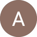 A white capital letter "A" inside a brown circle on a transparent background.