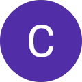 The letter "C" is centered inside a purple circle on a plain background.